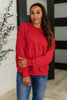 Sweet with a Side Eye Drop Shoulder Pullover in True Red